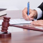 Male Judge Writing On Paper